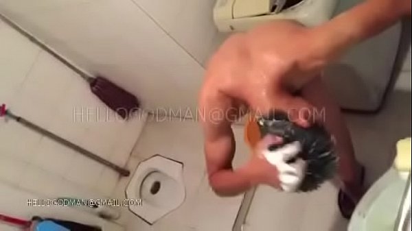 Adult Chinese man taking a shower